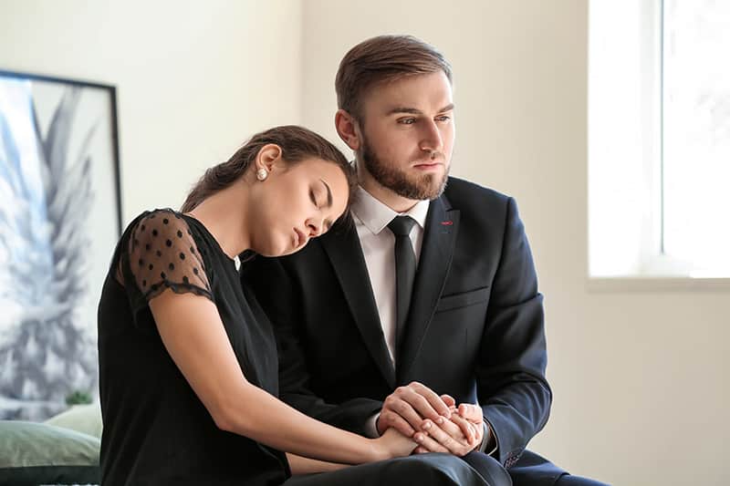 Couple Pining After Their Relative After Funeral